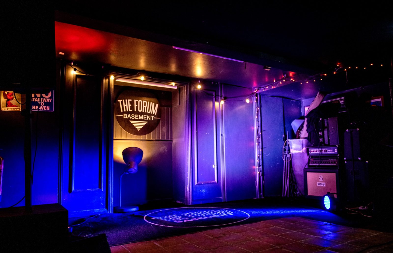 Purple and red lit stage at the Forum Basement live music venue in Tunbridge Wells