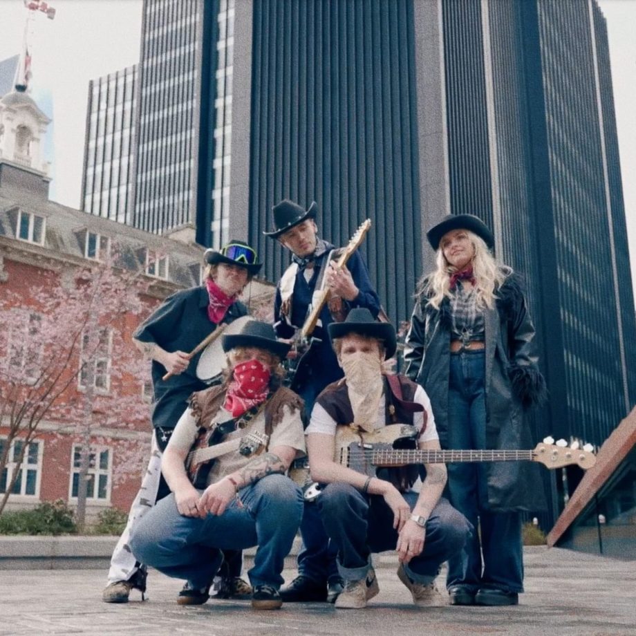 Promotional image of rock band Zap Euphoria wearing cowboy hats and neckerchiefs